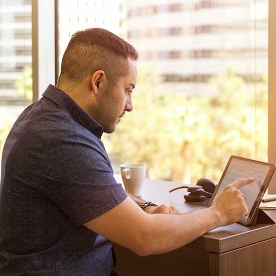 man working on tablet